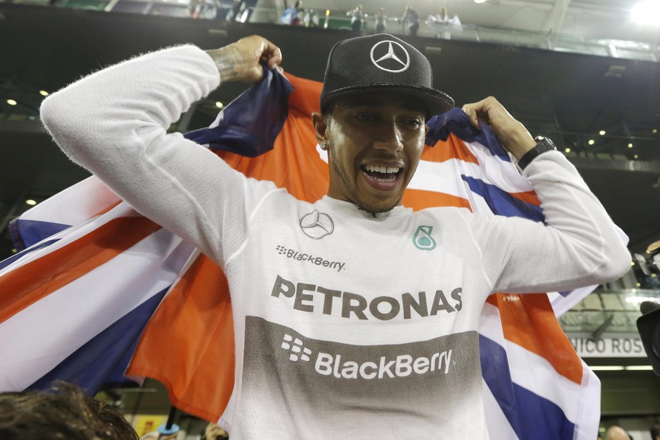 Abu Dhabi 2014. Lewis Hamilton viert zijn eerste wereldtitel voor Mercedes.