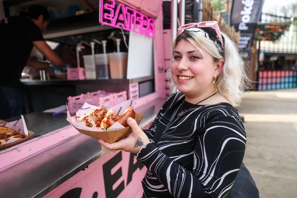 The festival attendant orders 'banh mi' from the Eaters food truck