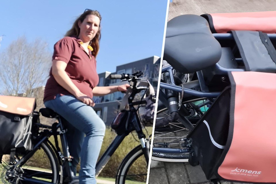 Zorgkundige Sarah De Rocker (40) en haar elektrische fiets van Oxford Cambridge met de opvallend rood-roze fietszakken van i-mens